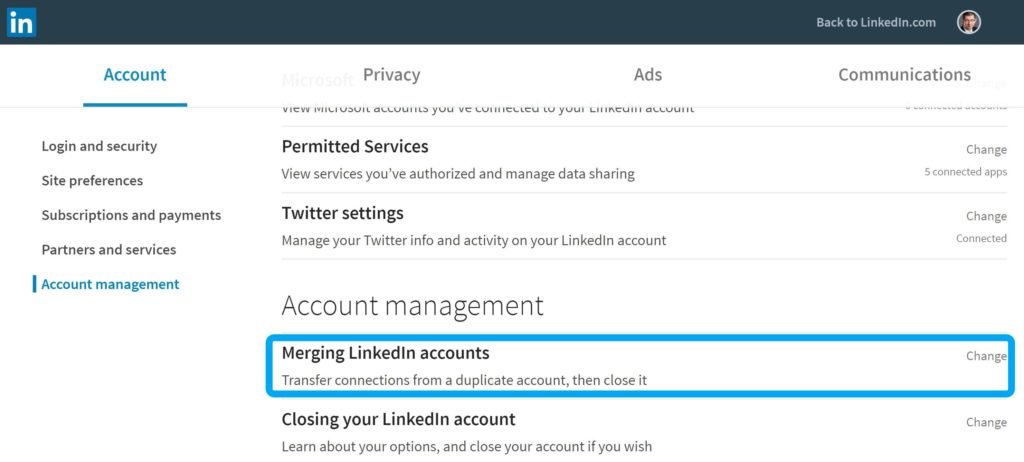 A professional laptop setup on a desk representing the process of merging LinkedIn accounts.